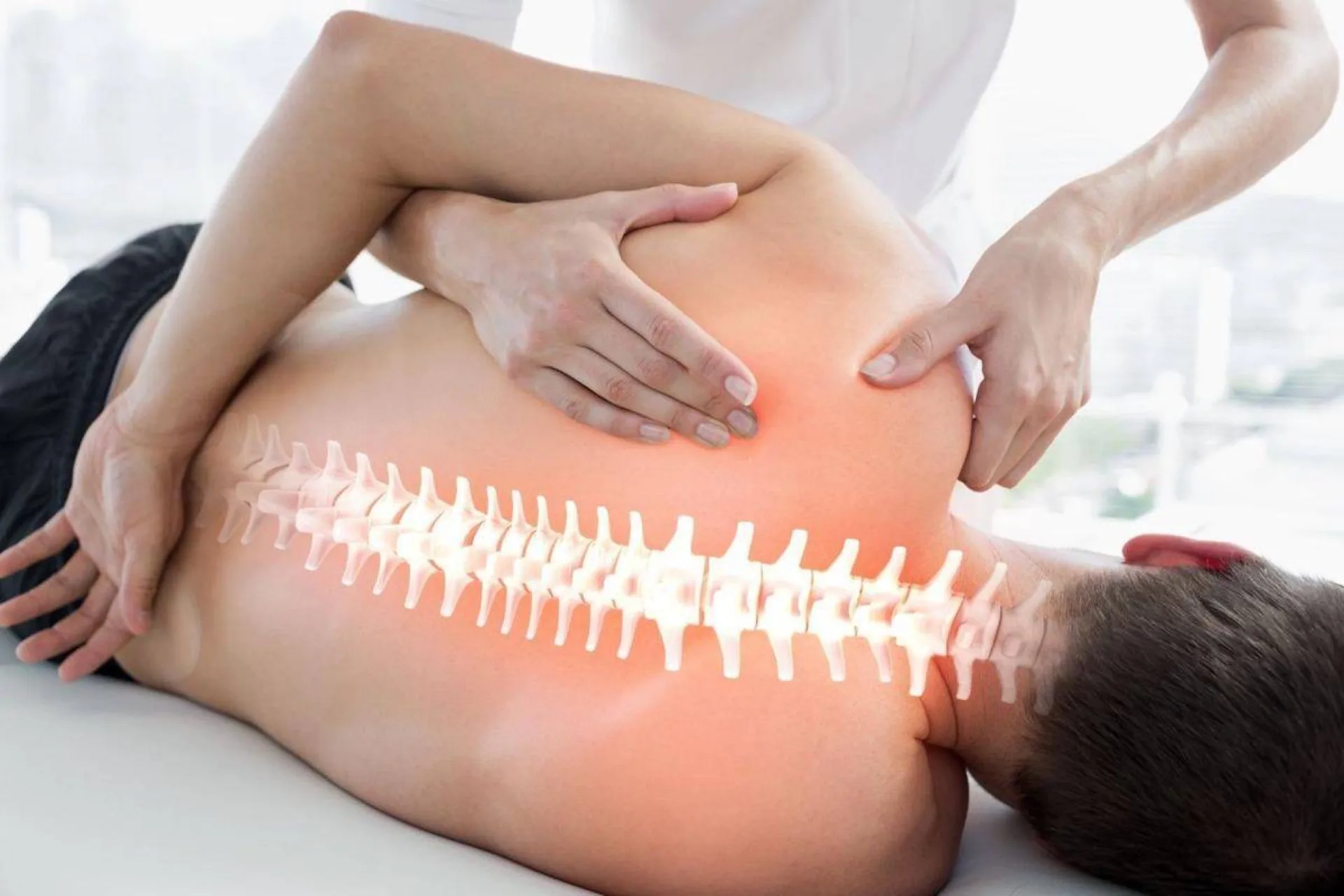 Dr. Rob Neuenschwander performing a spinal adjustment at Neu Life Chiropractic in Tomball, TX